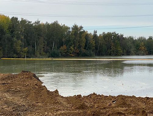 Remblayer un étang avec une barrière à sédiments